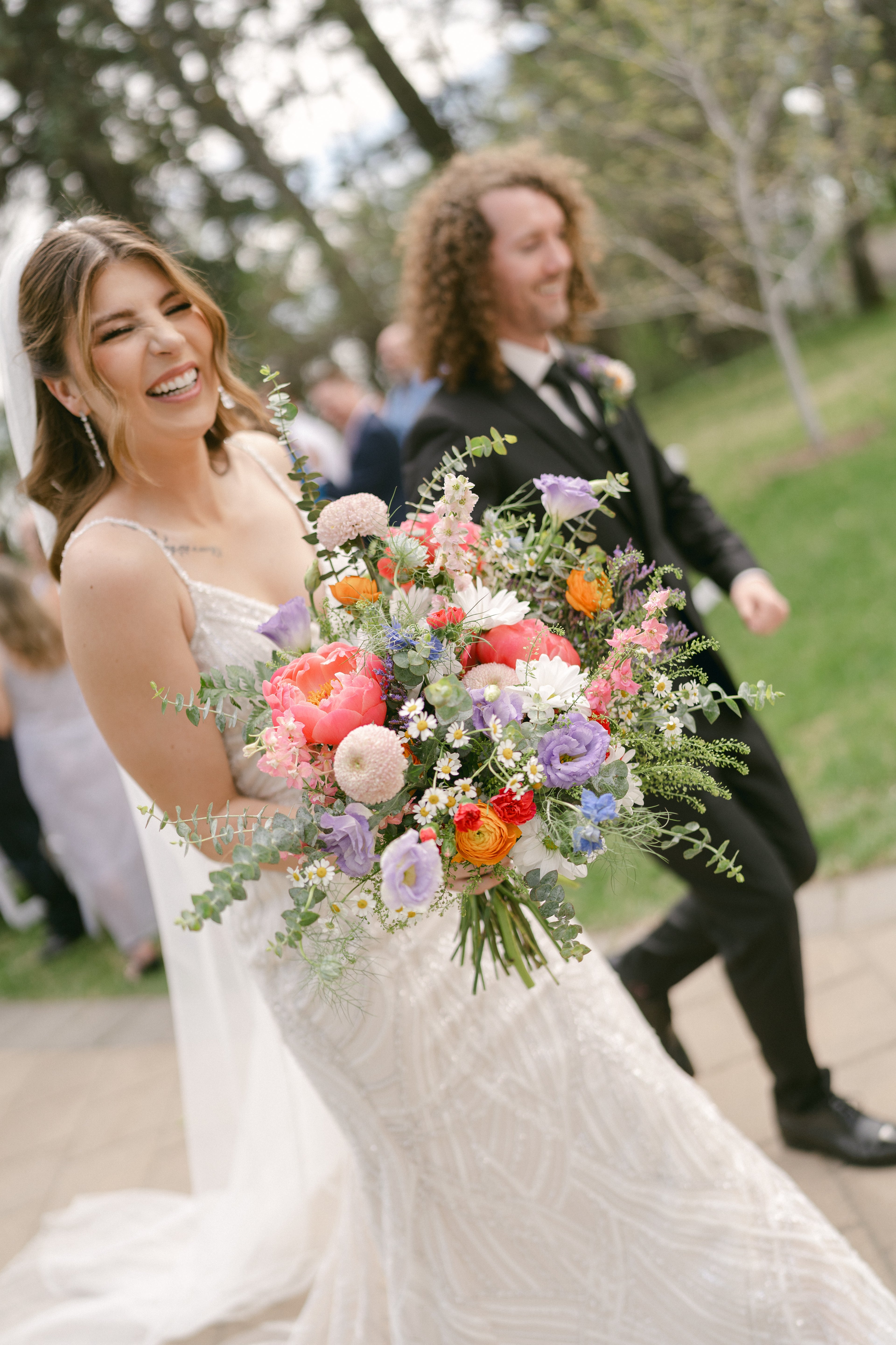 Lethbridge Wedding Flowers bridal bouquet bright wildflower pink coral orange lavender blue green spring wedding